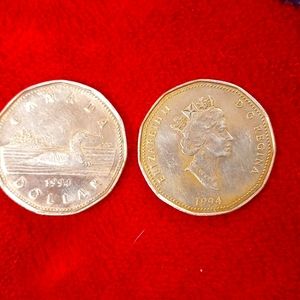 Two different one dollar Canadian one dollar coin